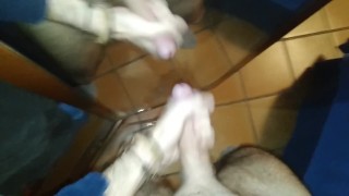 Jerking off and cumming in front of a mirror