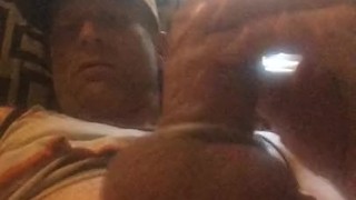 Stroking wearing cockrings.
