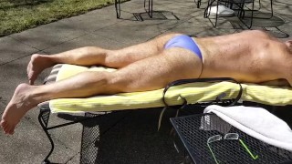 Sunning in a purple thong bikini where my neighbors can see