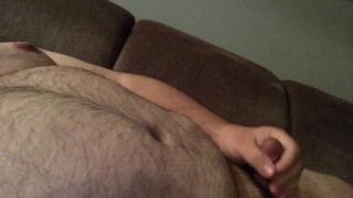 Front couch wank to some straight porn