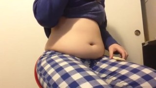 Chubby girl stuffs belly with junk food