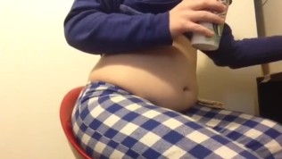 Chubby girl stuffs belly with junk food