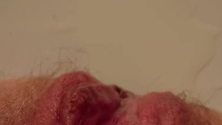Moaning from pleasuring hairy pissing pussy