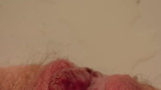 Moaning from pleasuring hairy pissing pussy