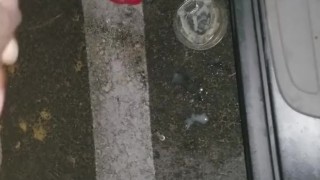 Cumming in public in a parking lot outside