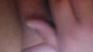 Masturbating