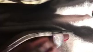 Feet in heels and rubbing on lotion