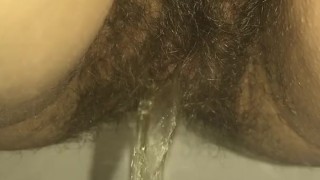 Hottie With A Hairy Pussy Pissing At Work