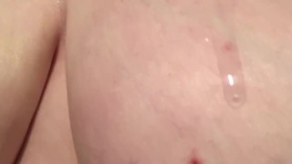 BBW oiling up her big breasts