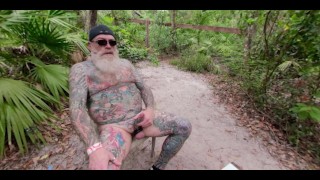 Inked Daddy Bear Stroking and Pissing in the Woods