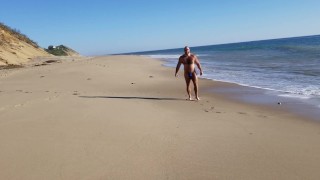 Beach walking in tiny bikini