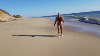 Beach walking in tiny bikini