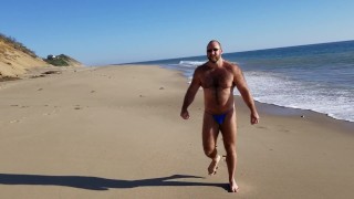 Beach walking in tiny bikini