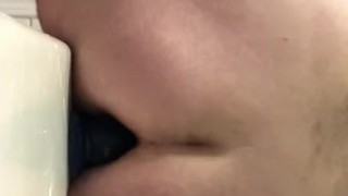 Riding a dildo