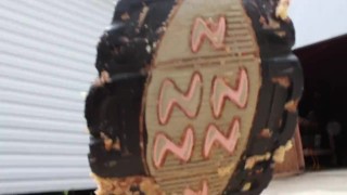 MILF crushes food under her heels outdoors