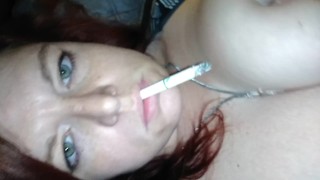 Smoking and teasing my tits and clit