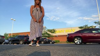 Peeing at crowded Best Buy parking lot.