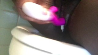 Creamy wet ebony pussy masturbation in public bathroom