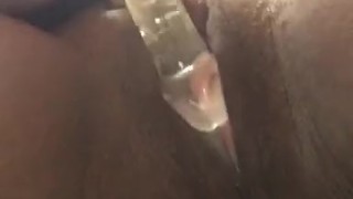 Ebony BBW with glass dildo making the pussy cream and drip