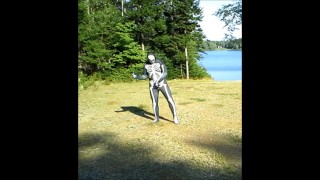 armed zentai skeleton outdoors in the sun