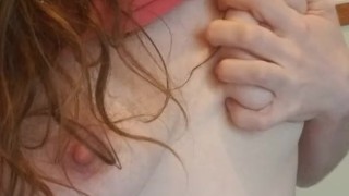 Slut plays with her small tits