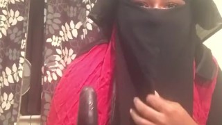 Lonely Niqabi Hijabi woman sucking dildo & shaking ass