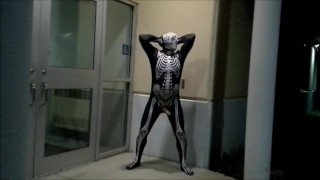 nighttime skeleton jerking off in front of outside doors