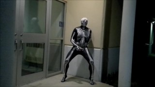 nighttime skeleton jerking off in front of outside doors