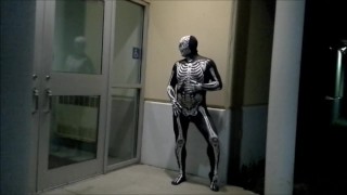 nighttime skeleton jerking off in front of outside doors