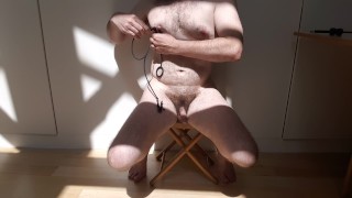 Guy plays with his tits and cums in the sun