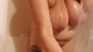 Chubby girl takes a hot soapy shower