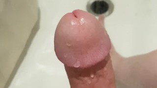 Delicious cock getting stroked in the shower