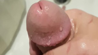 Delicious cock getting stroked in the shower
