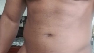 Muscle hunk swings big black dick