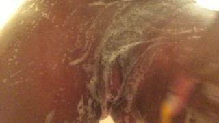 Sexy ebony playing with herself in the shower