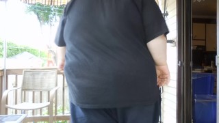 Fat men sitting outside happy