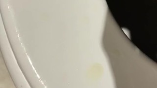 Peeing in the toilet.