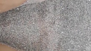 Rubbing feet in the sand