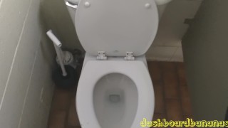 a large mirror in a gas station restroom before peeing.