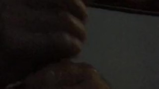 Hot guy uses both hands to stroke his long cock