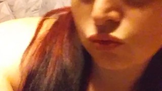 Sexy redhead teases with Pigtails and big natural titties
