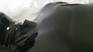 Close-up latex cock and mask