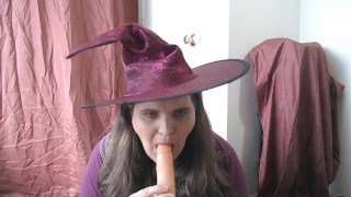 Halloween witch sucking a dildo