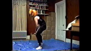 wearing black tights & crop top, stocking mask & wig hump air pillow 1990's