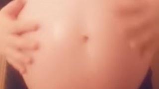 Big swollen pregnant belly with a beautiful princess inside
