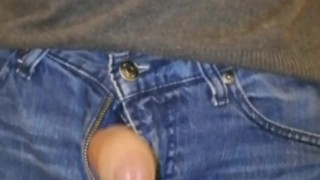 Uncircumsized cock taken out of jeans and stroked
