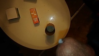 Sperm shot in a hole - handjob