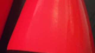 Shiny red latex rubber stockings closeup