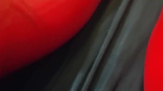 Shiny red latex rubber stockings closeup