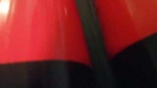 Shiny red latex rubber stockings closeup